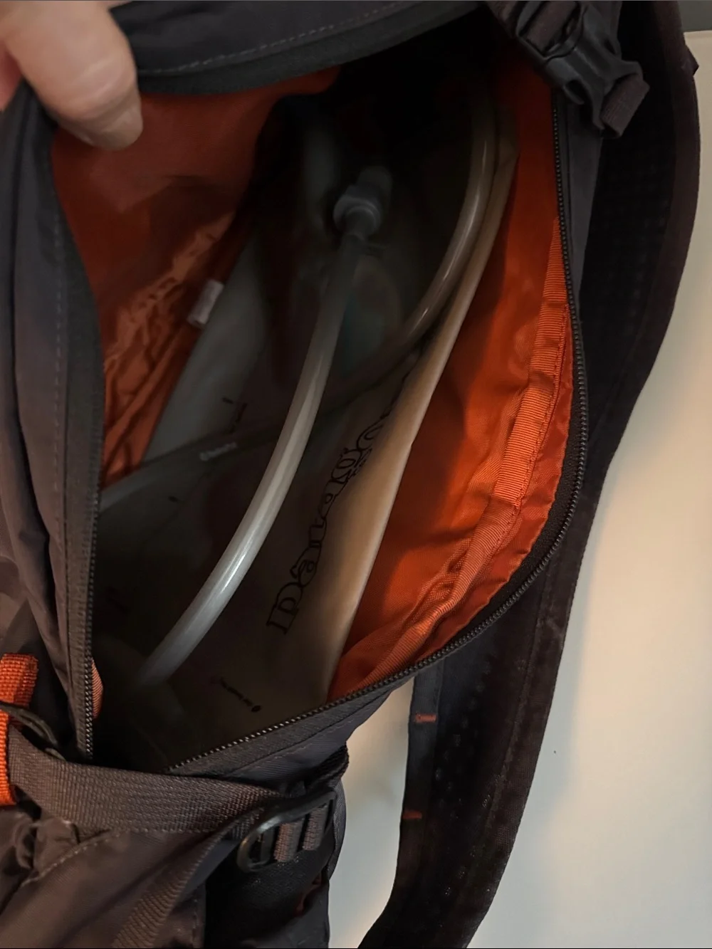 Patagonia Black Backpack with Orange Logo and Accents